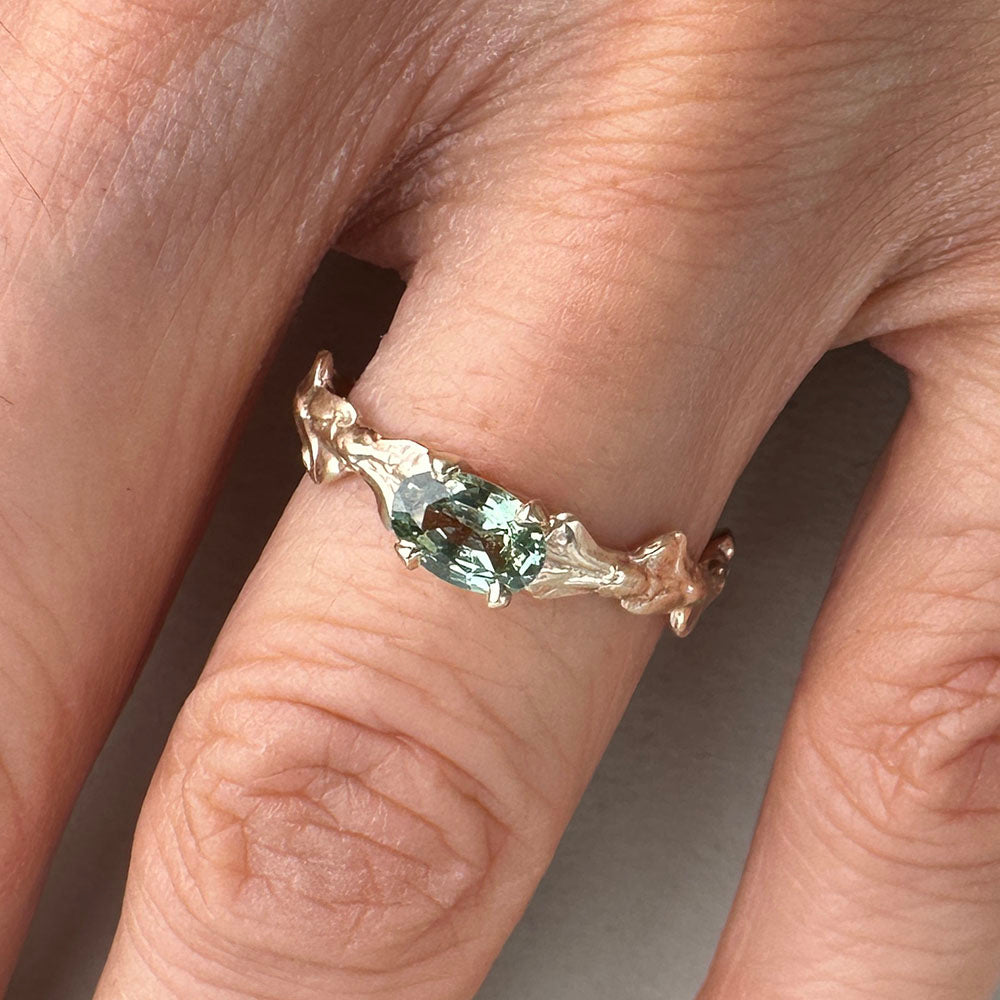 Conifer Leaf Engagement Ring in 9 carat Gold with Oval Green Sapphire