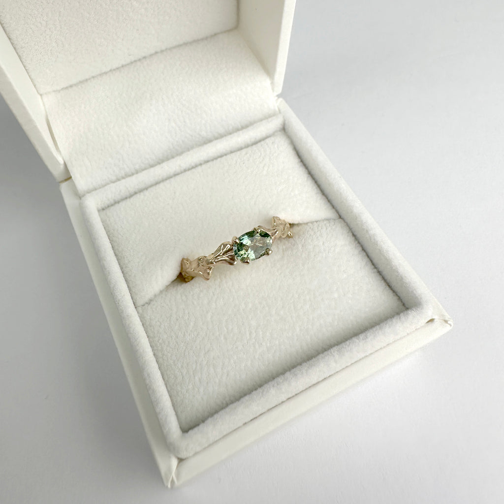 Conifer Leaf Engagement Ring in 9 carat Gold with Oval Green Sapphire