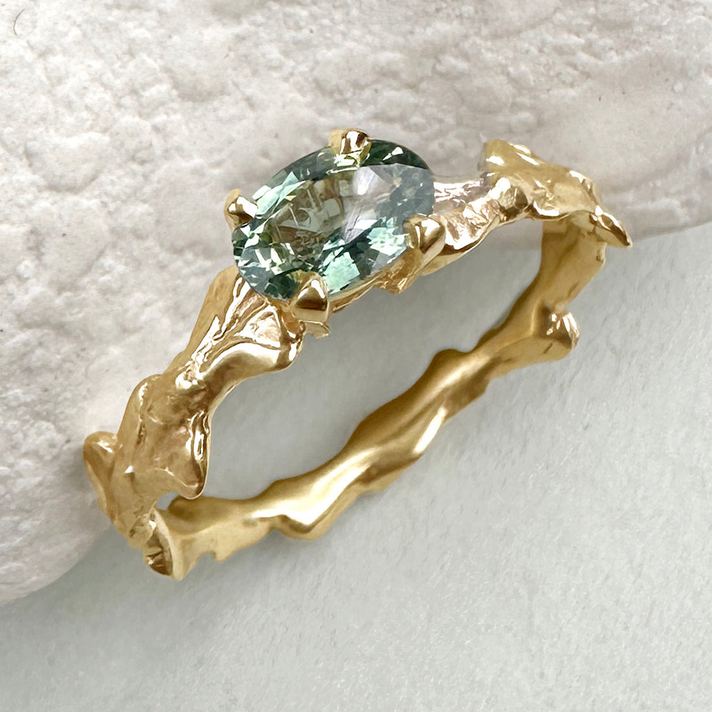 Conifer Leaf Engagement Ring in 9 carat Gold with Oval Green Sapphire