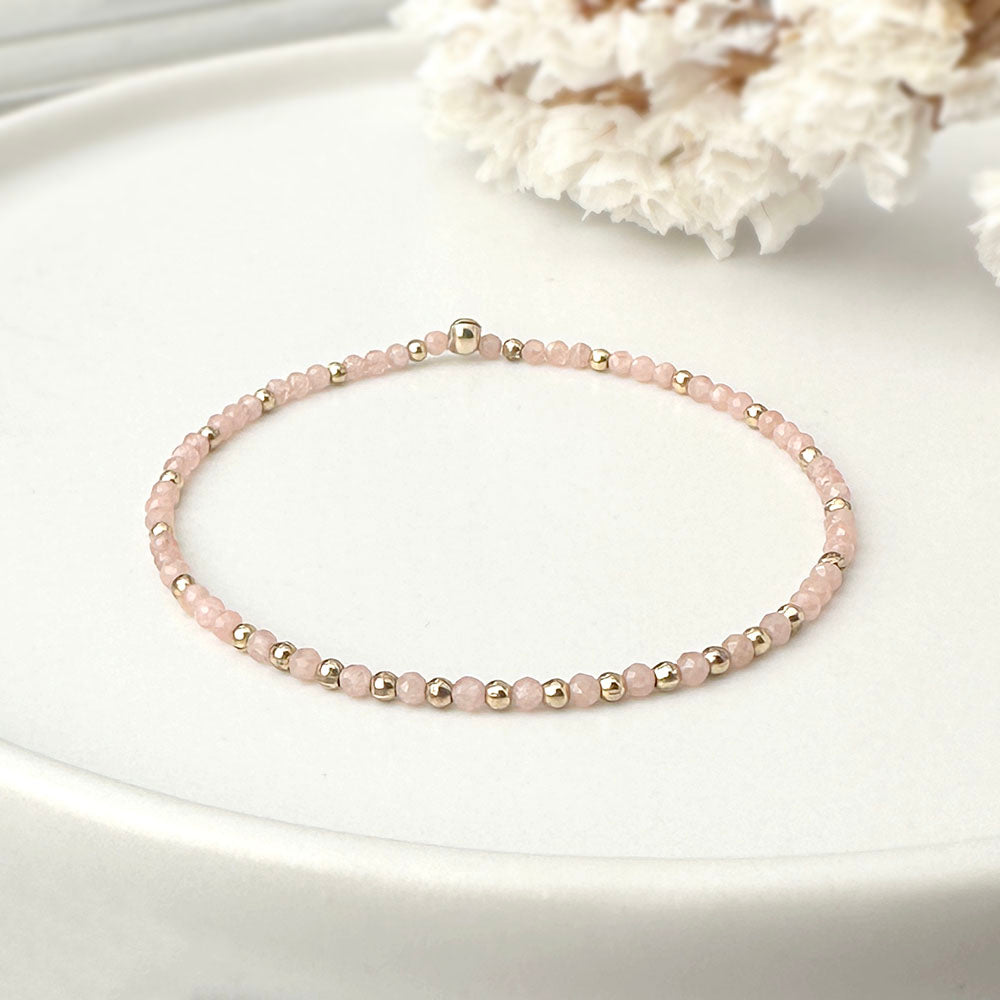 Stretch Bracelet with Rhodocrosite and Scattered Solid Gold Round Beads