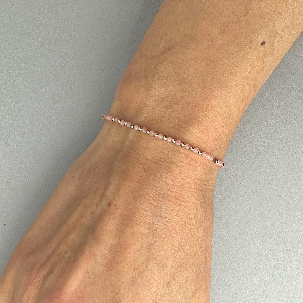 Stretch Bracelet with Rhodocrosite and Scattered Solid Gold Round Beads