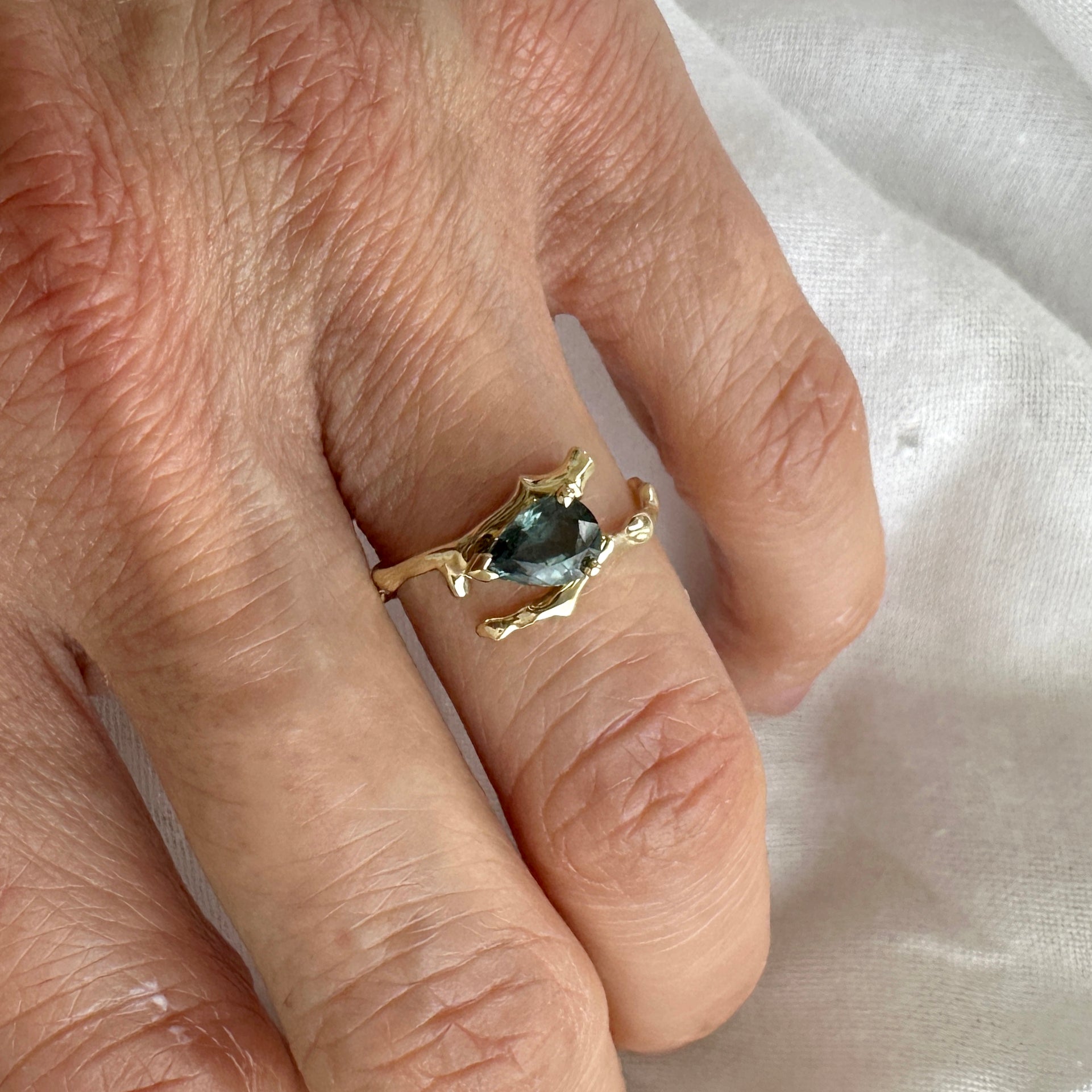 Twig Engagement Ring in 14 Carat Gold and Pear Cut Teal Sapphire