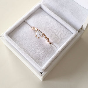 Twig Engagement Ring in 9 carat rose gold with rose cut white Ceylon sapphire