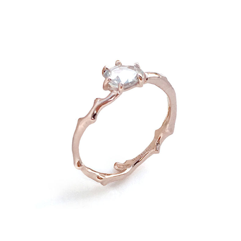 Twig Engagement Ring in 9 carat rose gold with rose cut white Ceylon sapphire