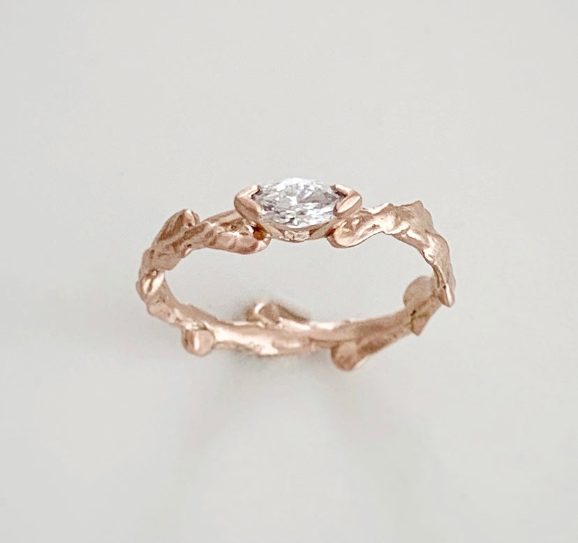 Conifer Leaf Engagement Ring in 9 carat Gold with Marquise Cut Sapphire