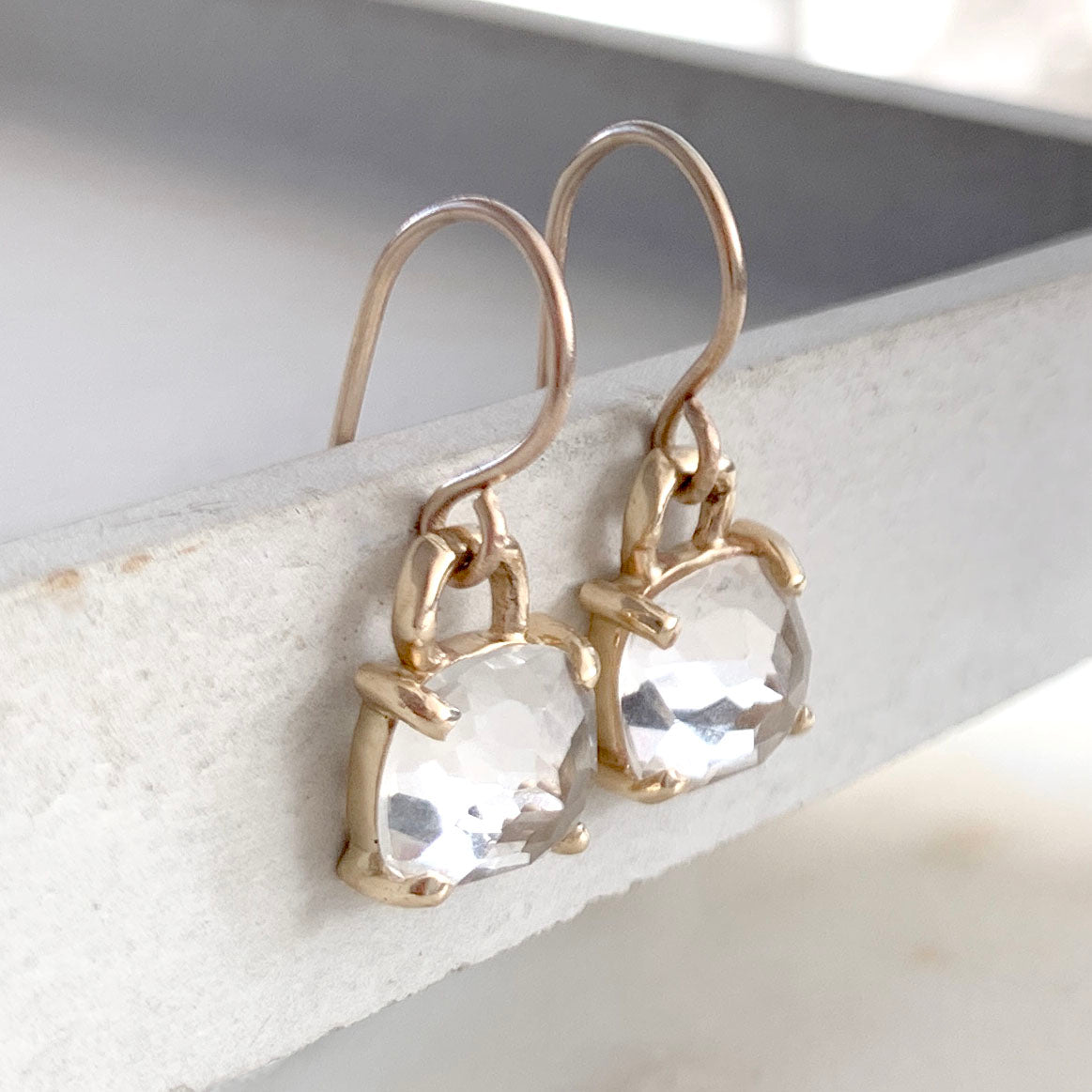 Drop earrings with square cushion cut white topaz with twig detail