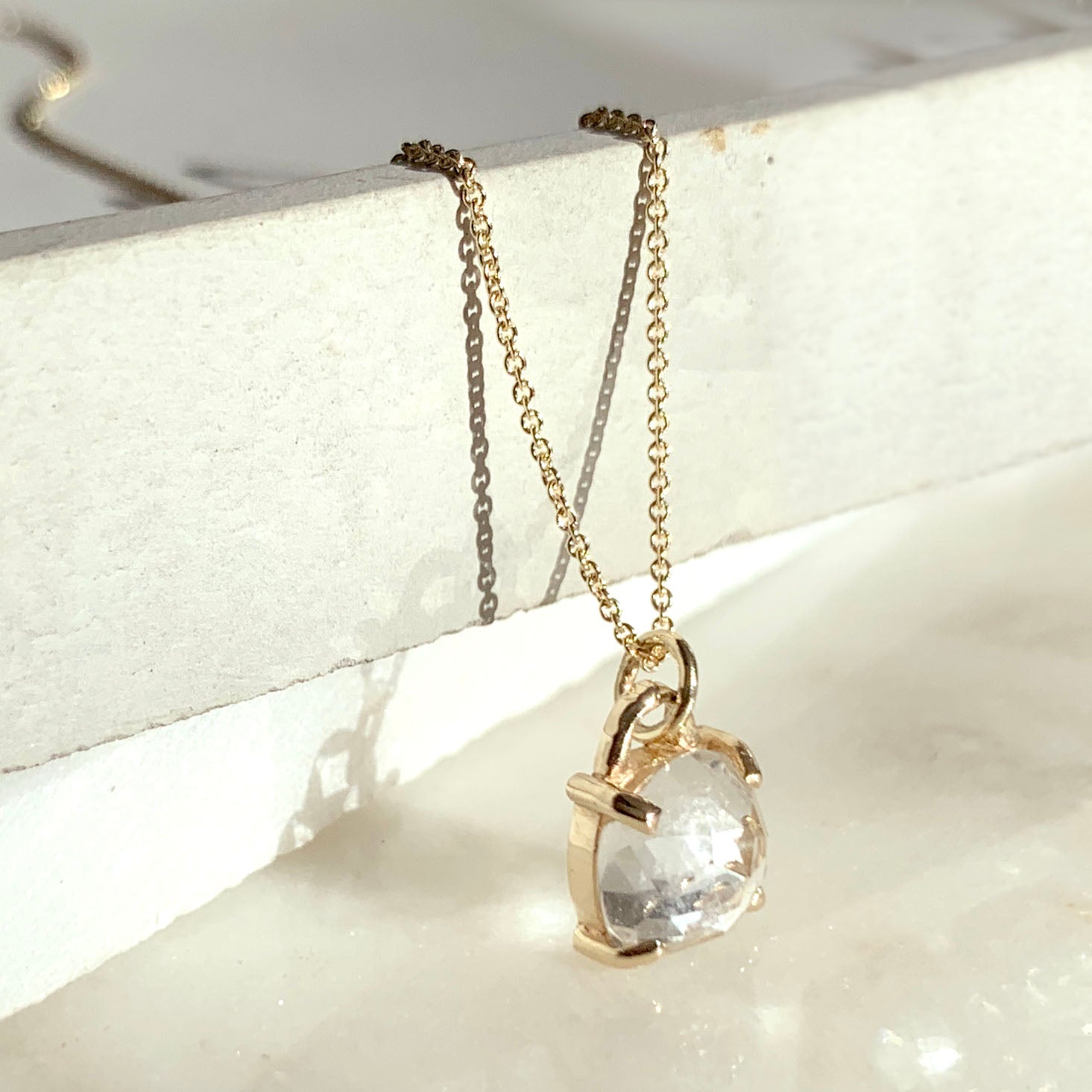 Gold necklace with square cushion cut white topaz